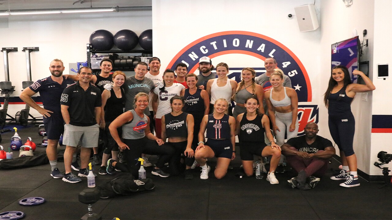 Mark Wahlberg poses for photo with staff at F45 Training in Jupiter