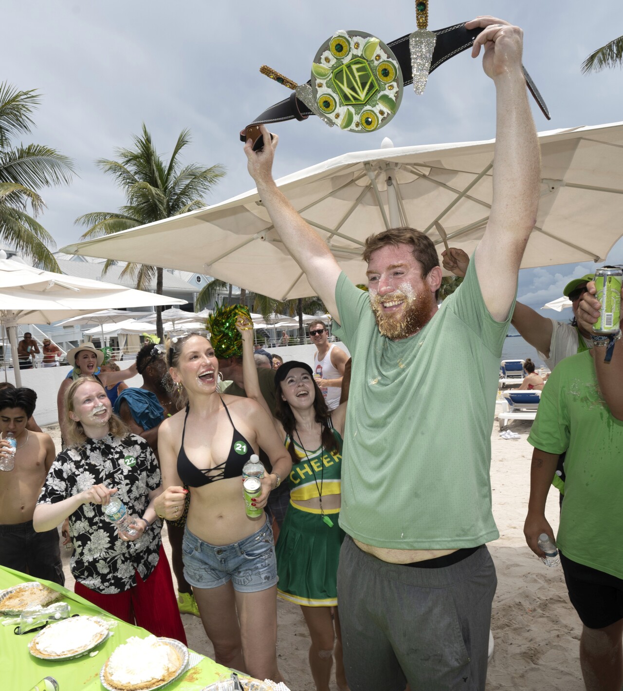 Joshua Mogle raises championship belt after winning Key Lime Pie Eating Competition, July 4, 2023