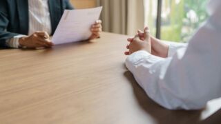 Stock image of an employer interviewing a prospective employee.