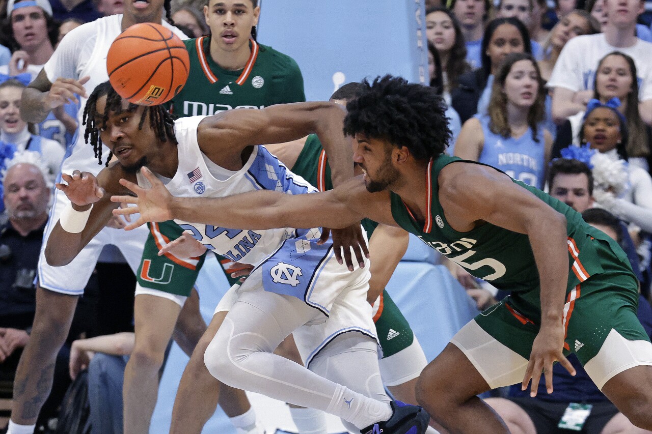 North Carolina Tar Heels forward Jae'Lyn Withers and Miami Hurricanes forward Norchad Omier battle for ball during second half, Feb. 26, 2024
