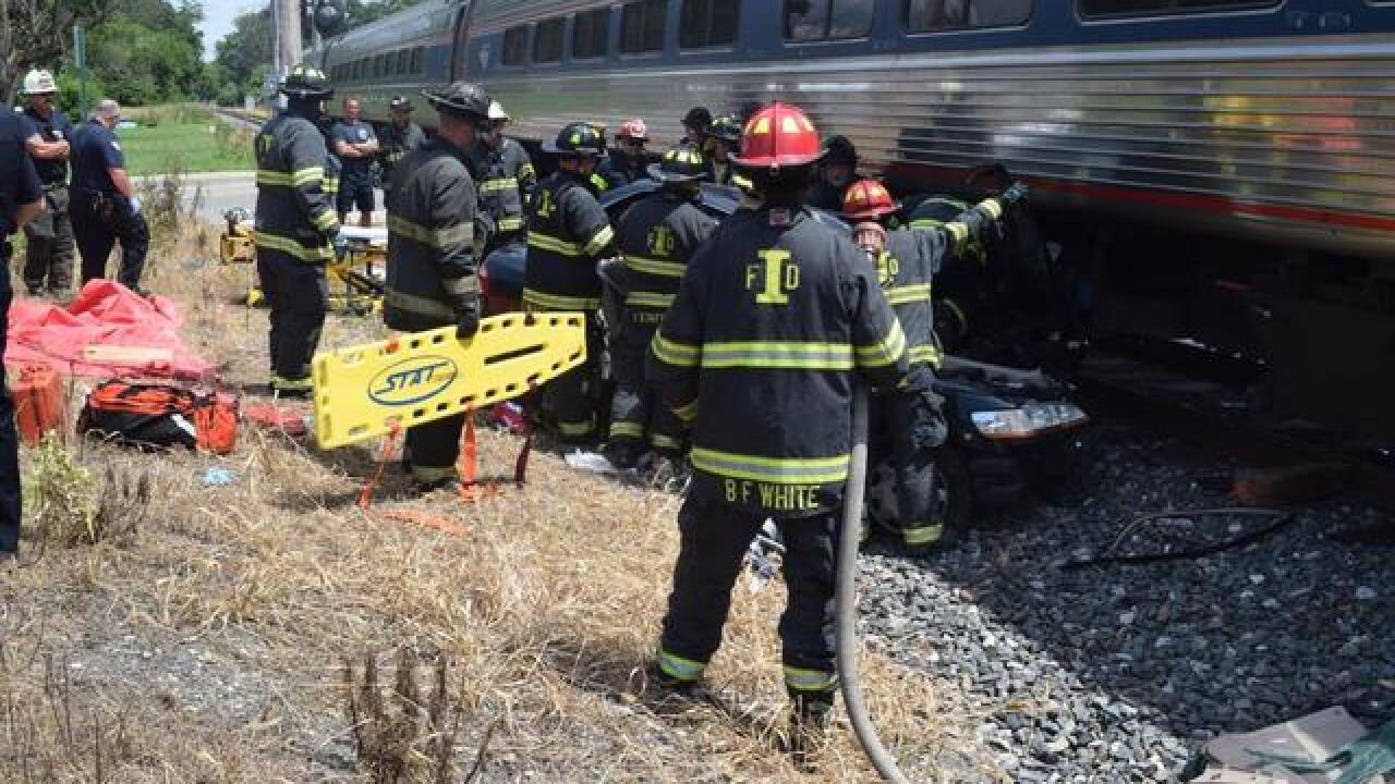 Woman rescued after car hit by train last July