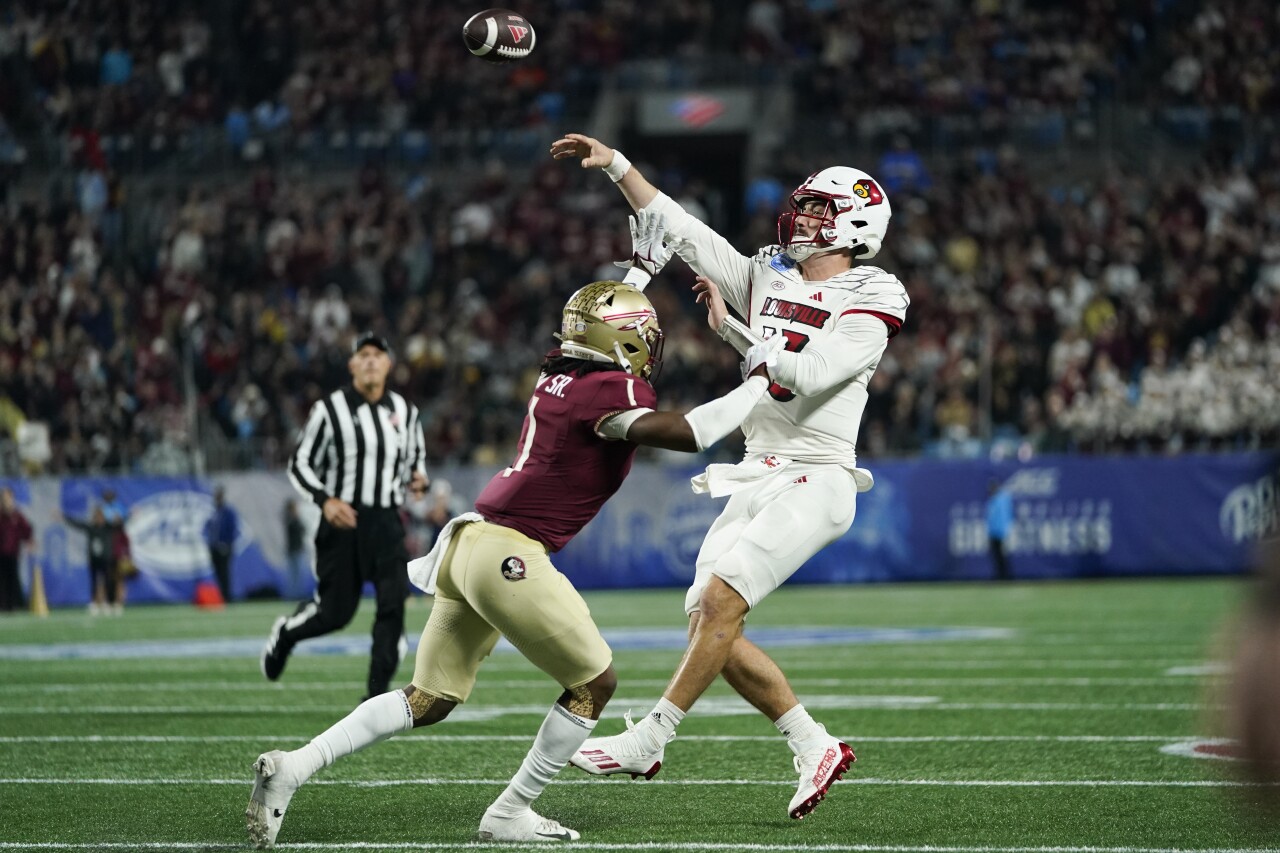 Florida State Seminoles safety Akeem Dent pressures Louisville Cardinals QB Jake Plummer in 2023 ACC Championship