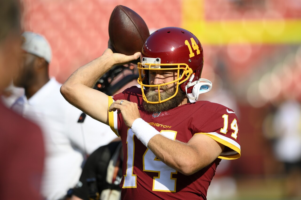 Washington QB Ryan Fitzpatrick warms up before 2021 preseason game