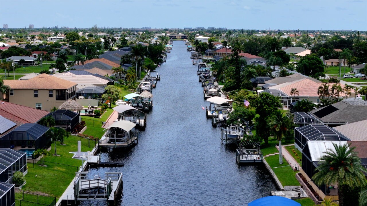 Aerial view of a dock lined canal in Cape Coral.