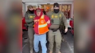 A man is detained by federal immigration officials at a Target. 