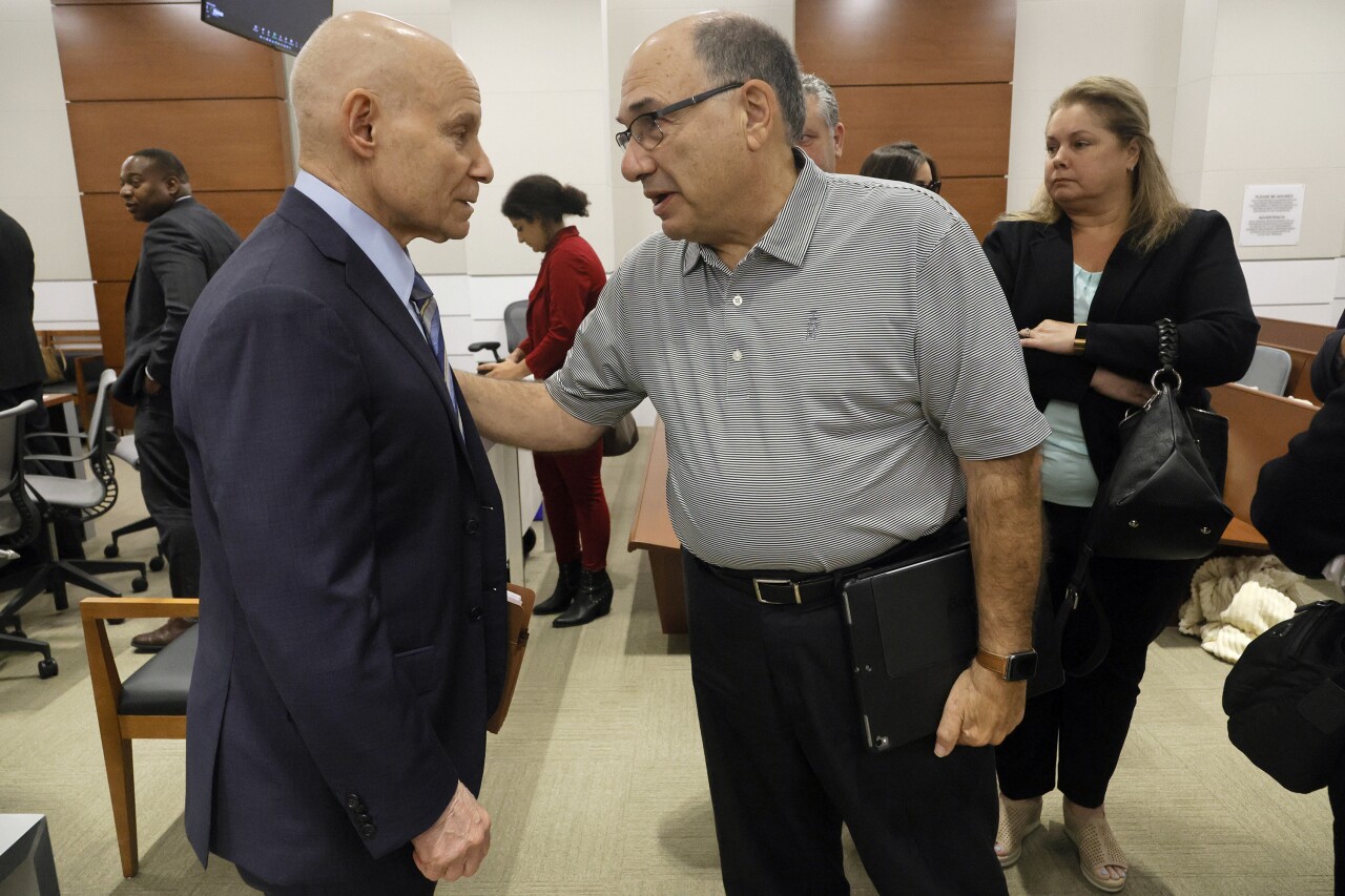 Michael Schulman greets Assistant State Attorney Mike Satz after closing arguments in penalty phase of Nikolas Cruz murder trial, Oct. 11, 2022