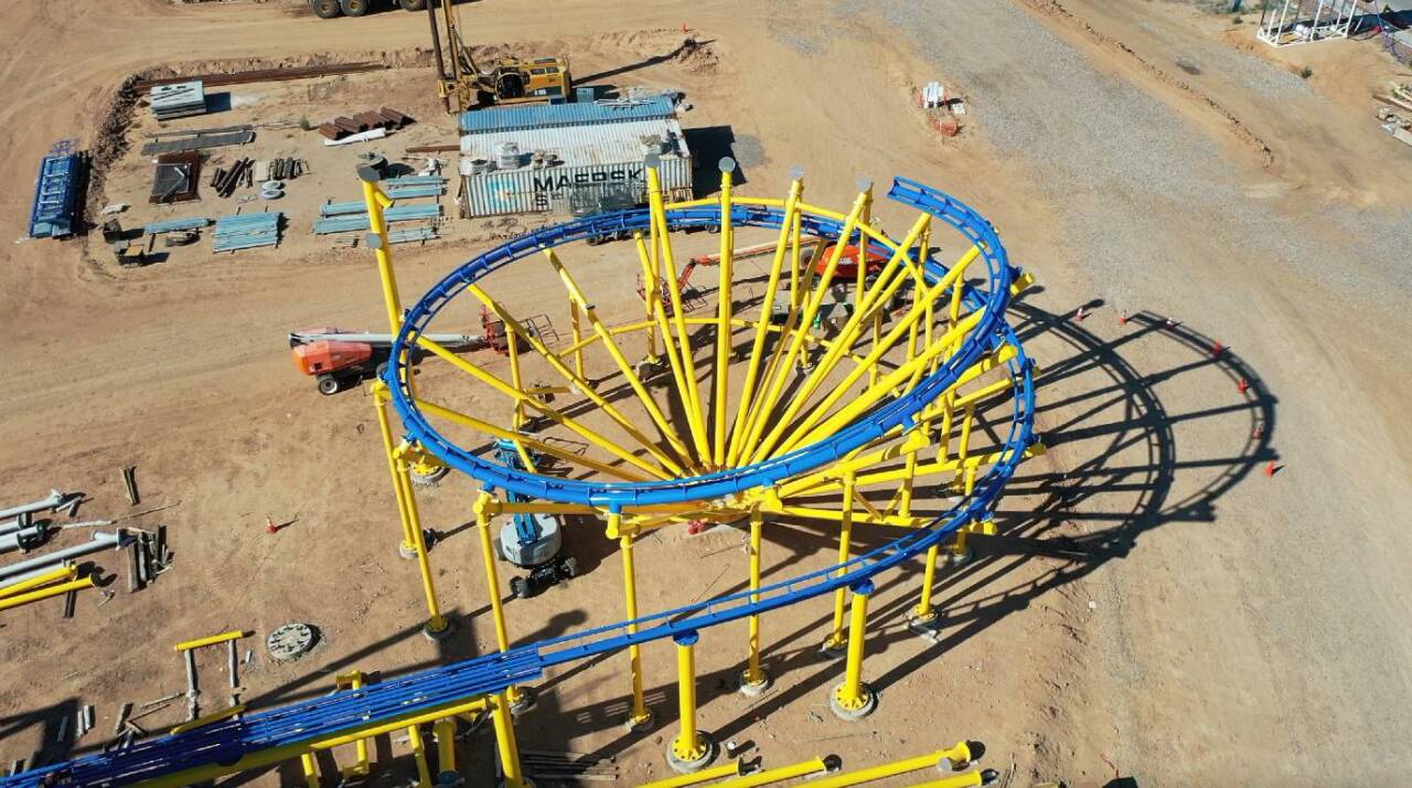 Aerial footage from the Mattel Adventure Park construction site where the rollercoaster will open: “This this ride like all of our rides, loads and unloads indoors, it will then peek straight through the roof on the lift, come out the upside of the roof, and it will bellow around the entire roof and come back into a double downward helix of 660 degrees comes back inside and slams on the brake. This is you know the ultimate in Hot Wheels experience,” said Cornell.