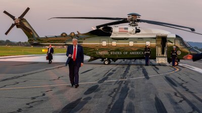 President Donald Trump walks from Marine One to speak with reporters at Lehigh Valley International Airport, Sunday, Aug. 3, 2025, in Allentown, Pa.