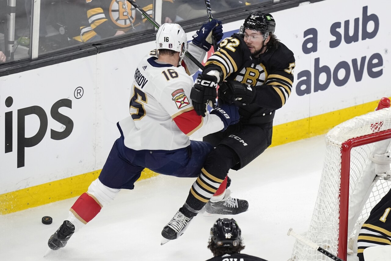 Boston Bruins defenseman Andrew Peeke and Florida Panthers center Aleksander Barkov battle for puck during first period, May 12, 2024