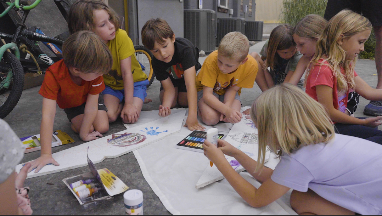 Stontree's climbers helping the soapbox derby team get ready for their big day