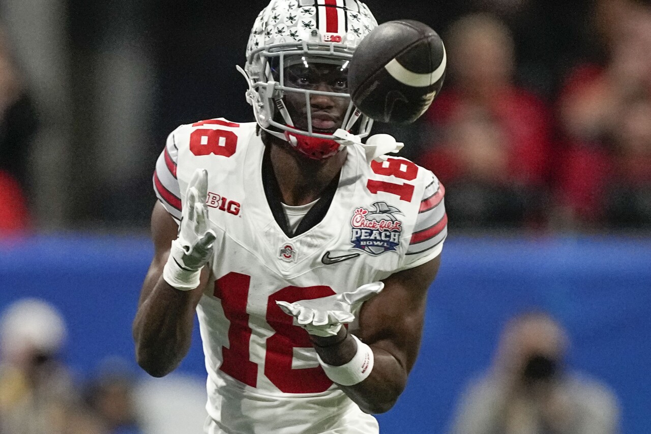 Ohio State Buckeyes receiver Marvin Harrison Jr. catches pass against Georgia Bulldogs in first half of College Football Playoff semifinal at Peach Bowl, Dec. 31, 2022