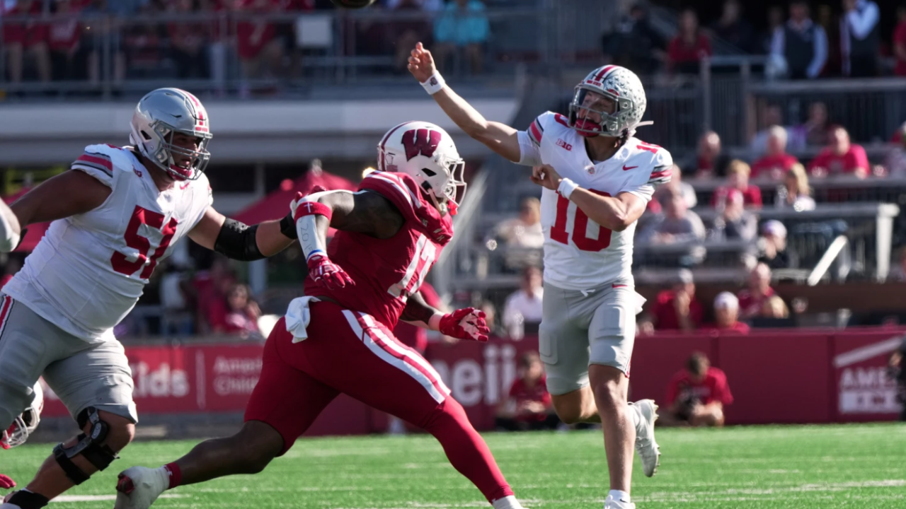 Ohio State's Julian Sayin throws a touchdown pass during the first half of an NCAA college football game against the Wisconsin Badgers Saturday, Oct. 18, 2025, in Madison, Wis.