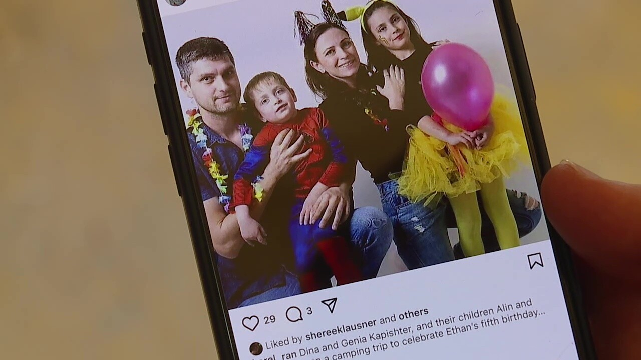 Andrew Gotlieb shows a photo of a family killed on Oct. 7, 2023, during Hamas-led attacks on Israel. They were part of an Israeli investor group behind a townhome project in Cleveland's Tremont neighborhood.