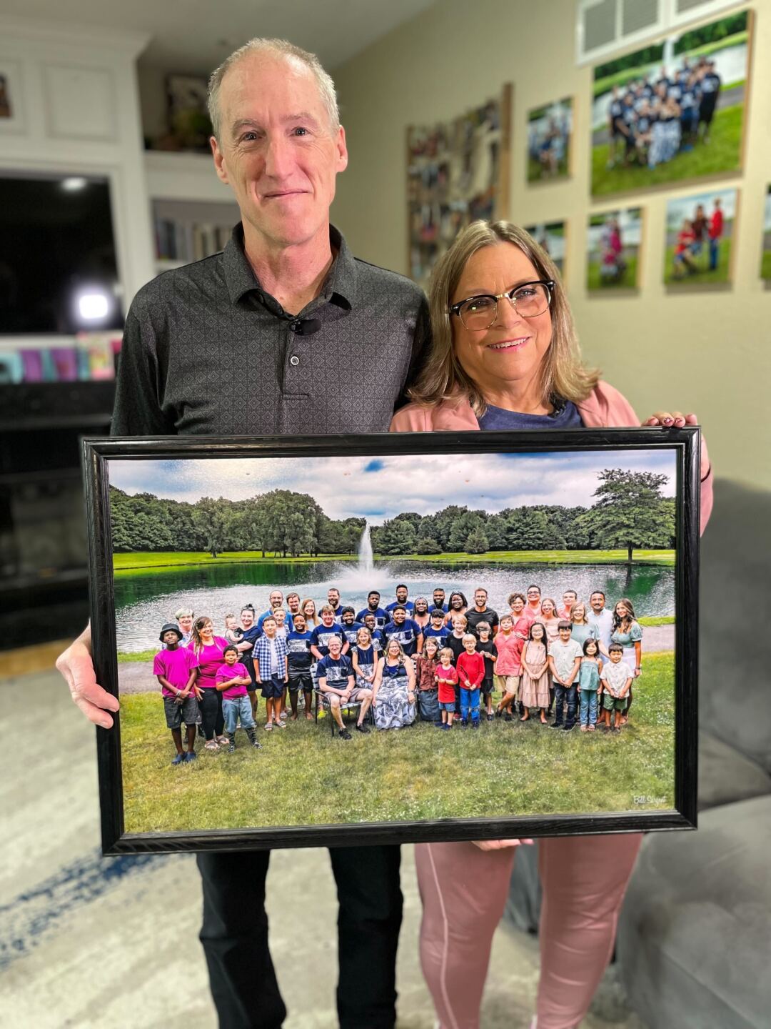 Dan and Lori hold photo of family