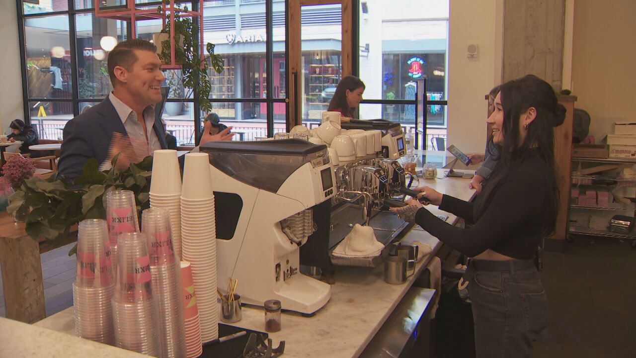Elixr barista Brooke Wolfe shows Ben Hill how to step up his coffee game.