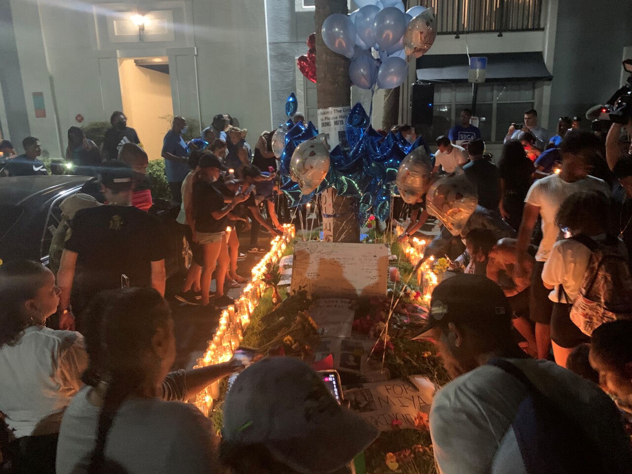 Family and friends of Miya Marcano came together at her apartment in Orlando for a vigil after her body was found in a wooded area Saturday.