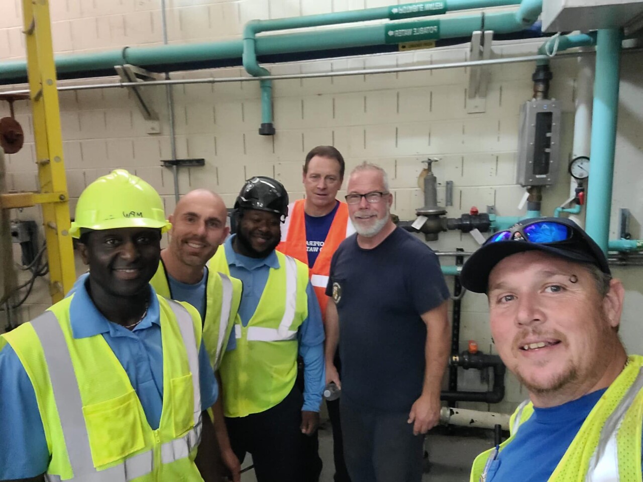 Anne Arundel County employees Rob Swann and Phil Daley are pictured with co-workers from WSSC and South Carolina