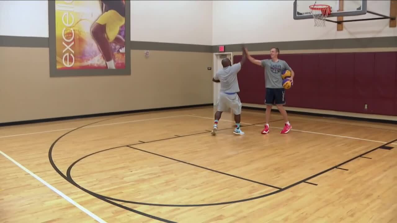 Canyon Barry and Todd Wilson high five each other