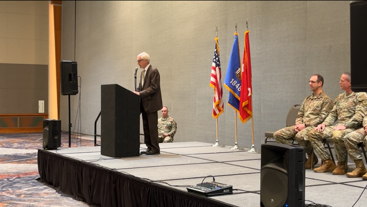 Wisconsin Gov. Tony Evers speaks at the Baird Center in Milwaukee during the Wisconsin National Guard's holiday season deployment ceremony on Sunday, Nov. 30, 2025.