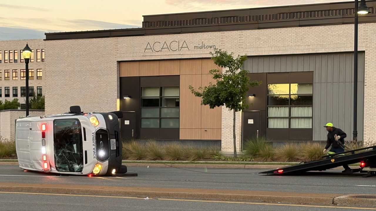 Ambulance flips in crash.png