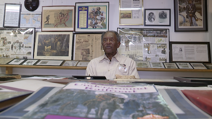 luther smith shows off artifacts.png