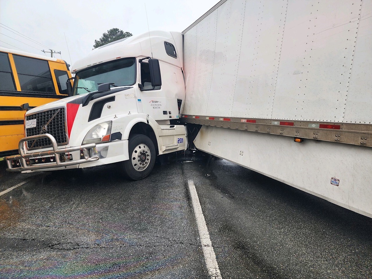 Authorities respond to crash involving semi, bus in Suffolk; No one hurt