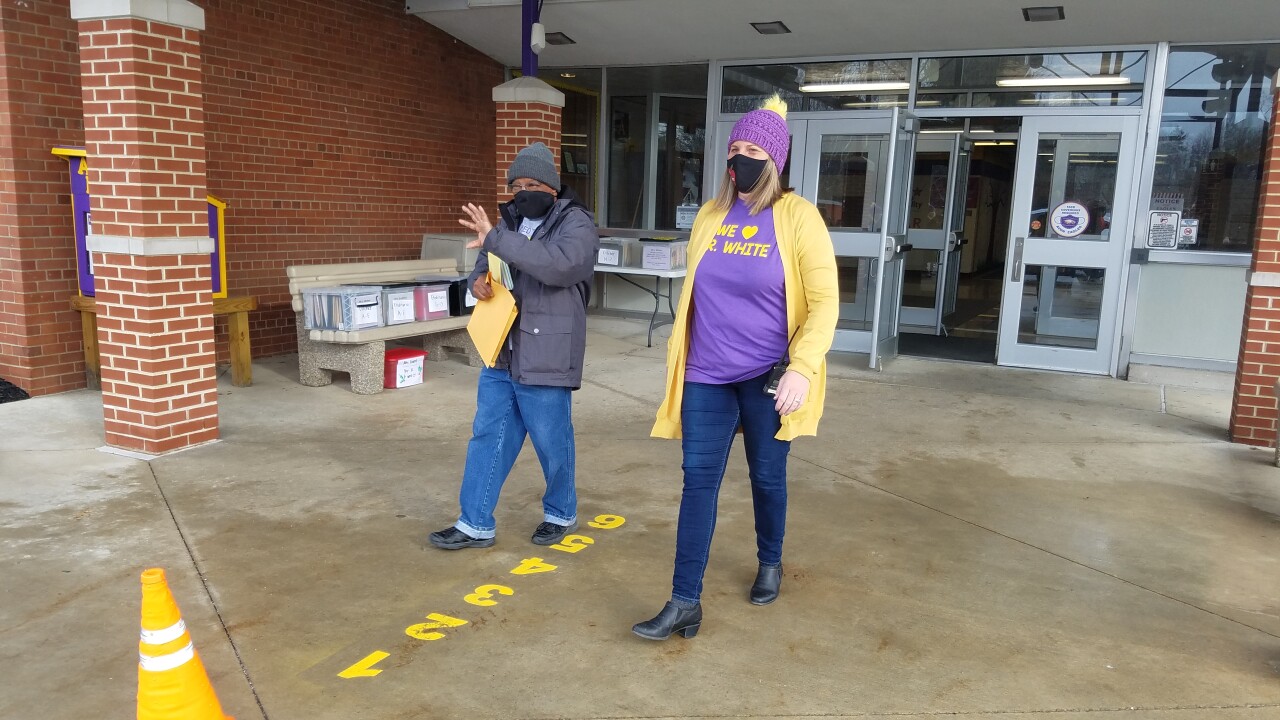 2) Mr. White leaving the AELC with Principal Colleen Mudore.jpg