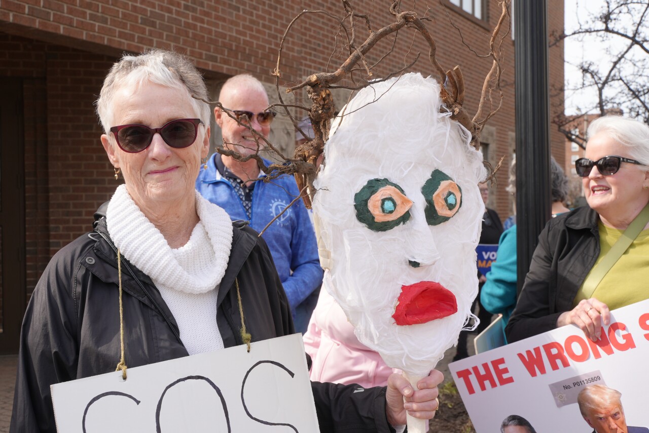 Protest outside of Rep. Bill Huizenga's office in Holland