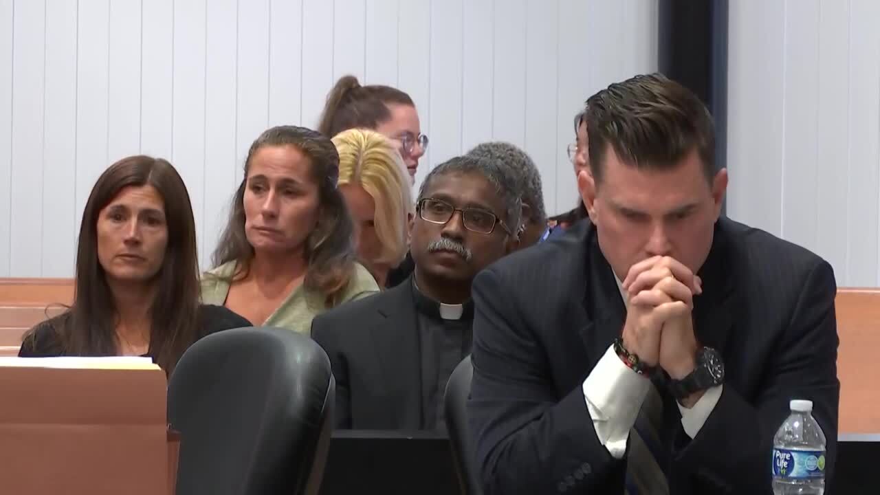 Tim Ferriter sits with head down as Tracy Ferriter looks on during his trial, Oct. 4, 2023