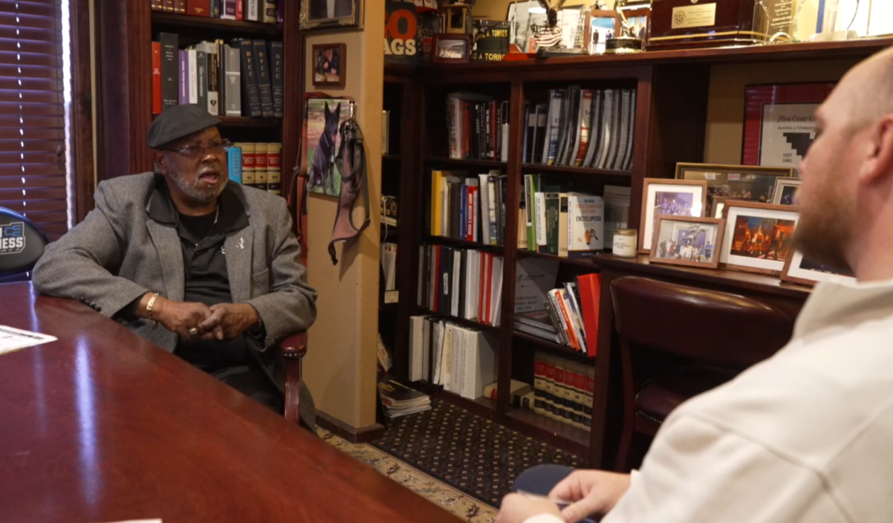 Neighborhood Reporter Sam Hoyle interviewing Eric Huggins Sr. who spent several years in jail before turning his life around for the better.