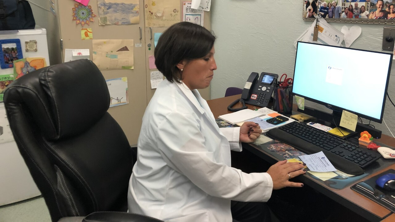 Royal Palm Beach Elementary School nurse Marianella Halleran works in a health room on Aug. 26, 2022.jpg