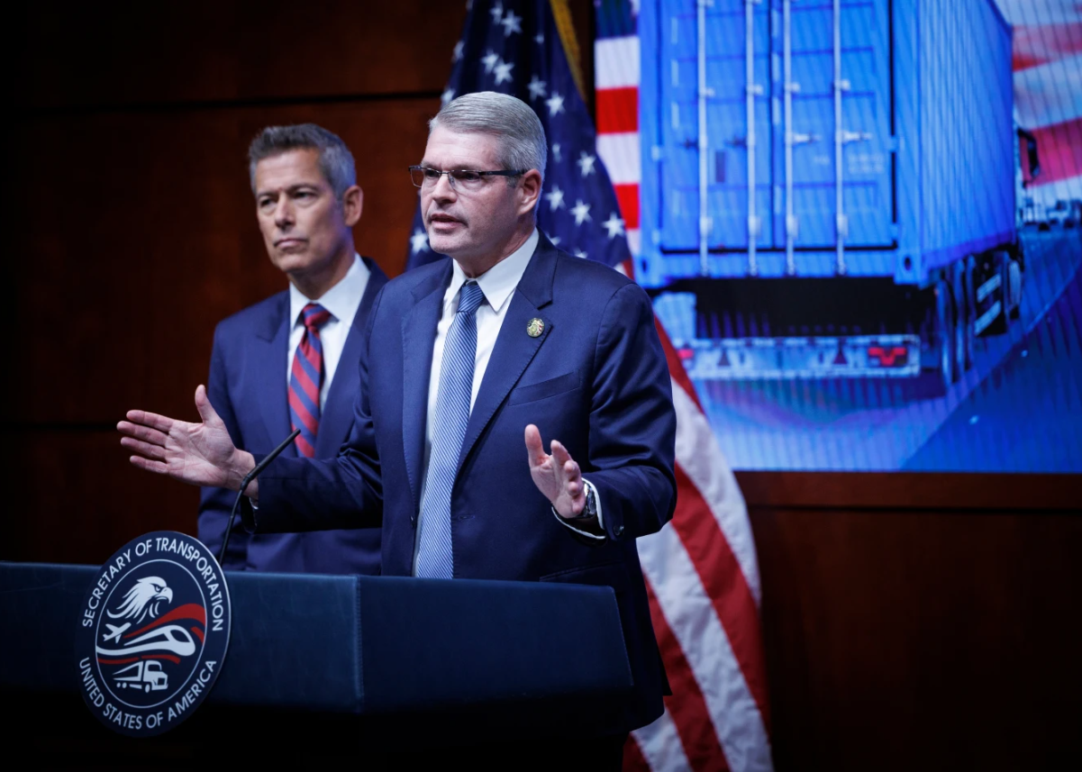 Federal Motor Carrier Safety Administrator Derek Barrs speaks beside U.S. Department of Transportation Secretary Sean Duffy, left, during a news conference on enhancing truck driving safety at the U.S. Department of Transportation on Friday, Feb. 20, 2026, in Washington.