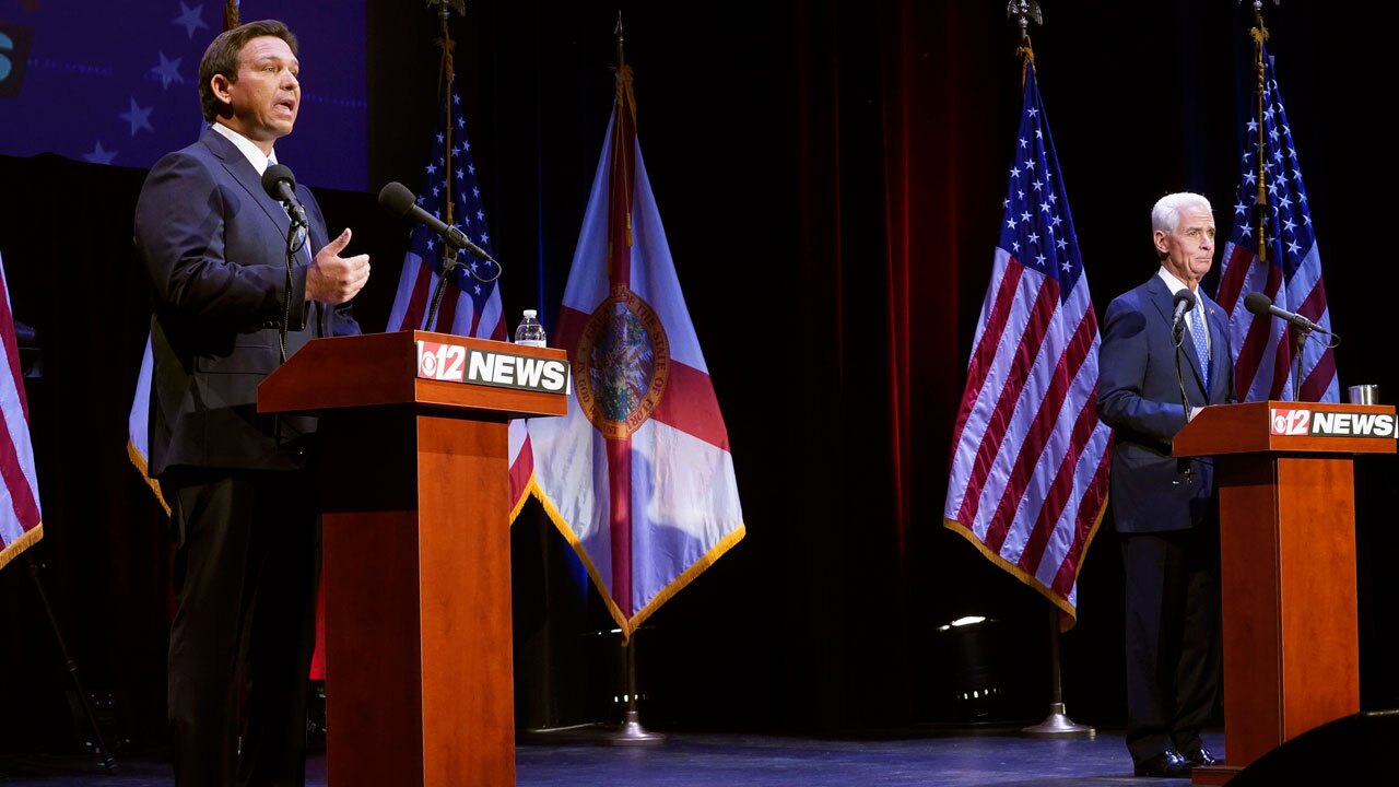 Florida's Republican Gov. Ron DeSantis, left, speaks during a debate with his Democratic opponent Charlie Crist in Fort Pierce, Fla., Monday, Oct. 24, 2022.