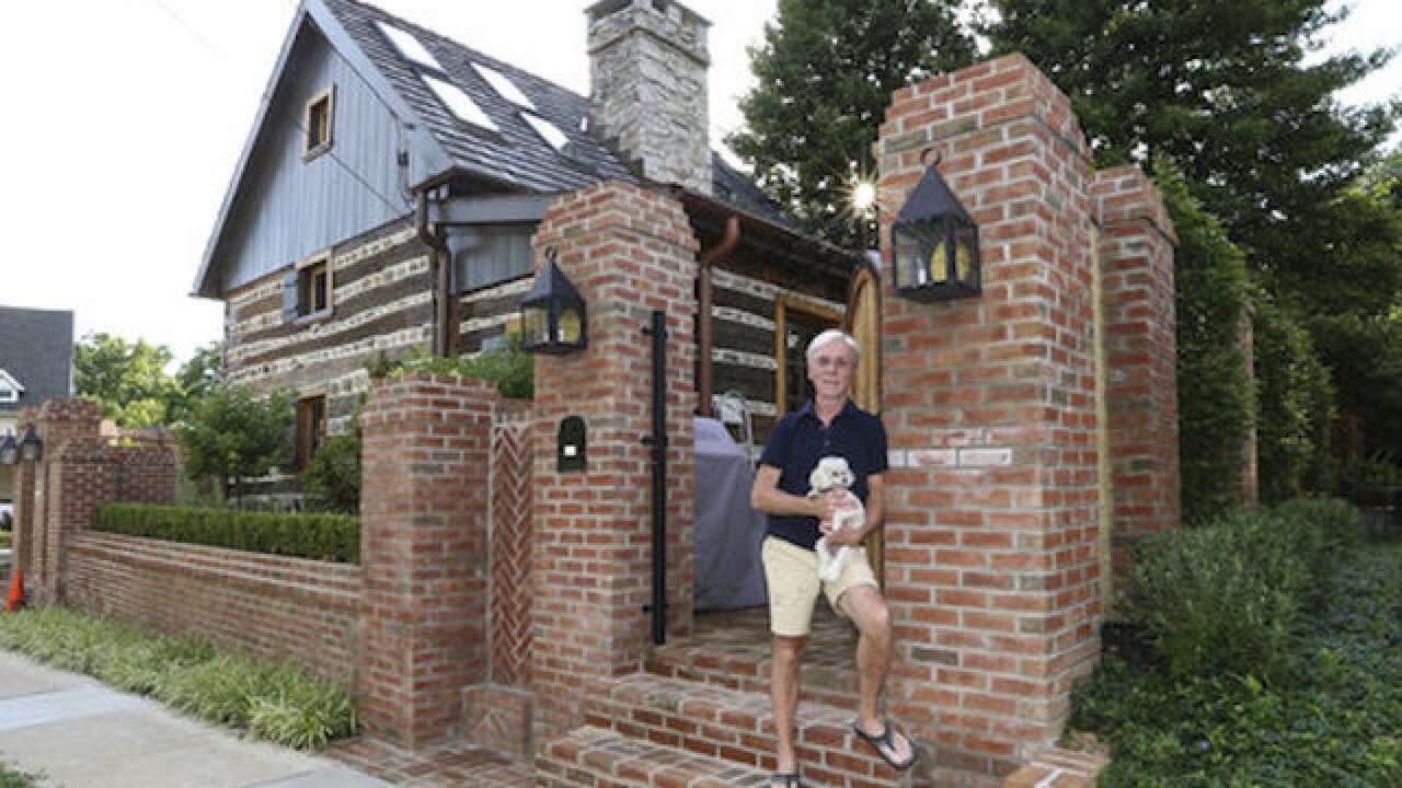 Man finds out small house is actually 300-year-old log cabin