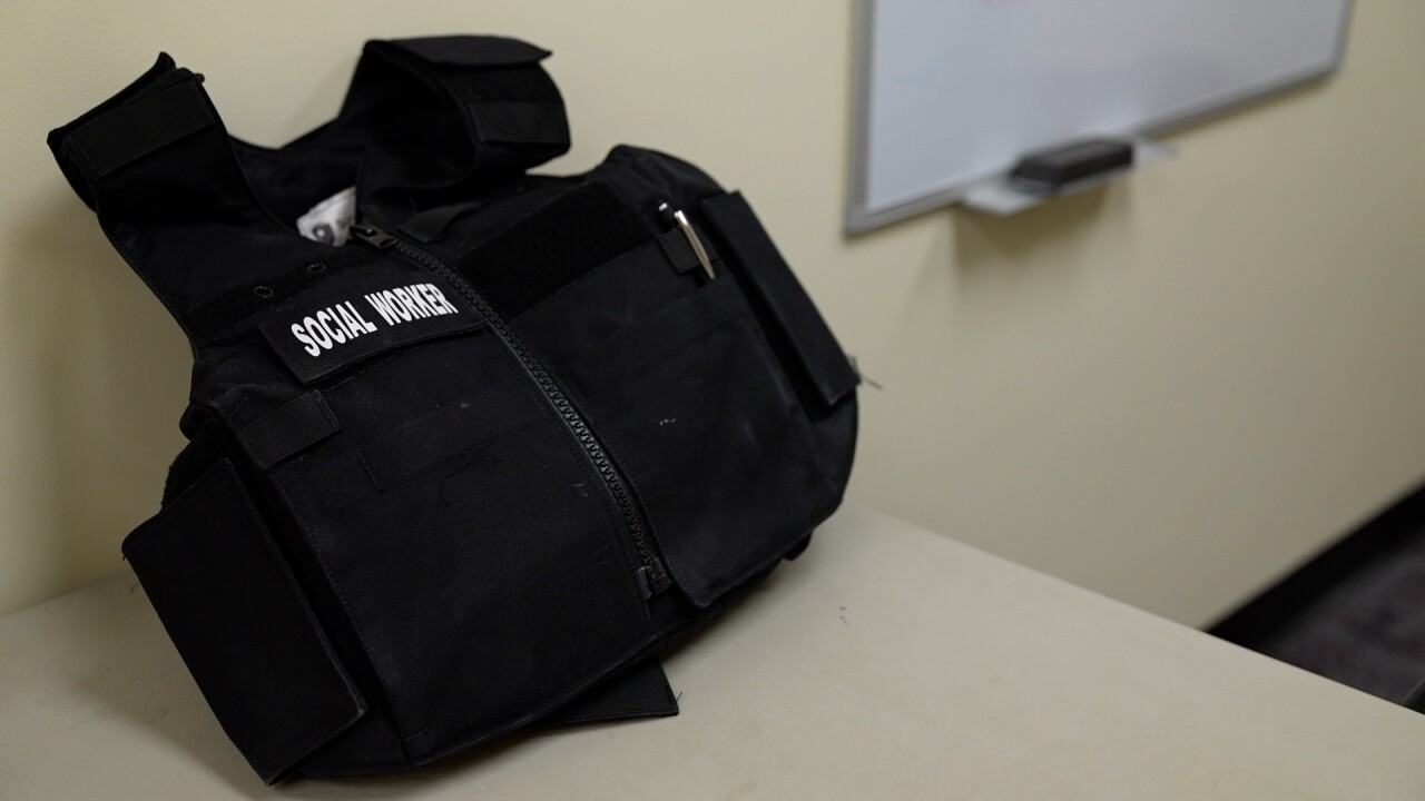 Jan Bidwell's bulletproof vest with the words "social worker" stitched on it