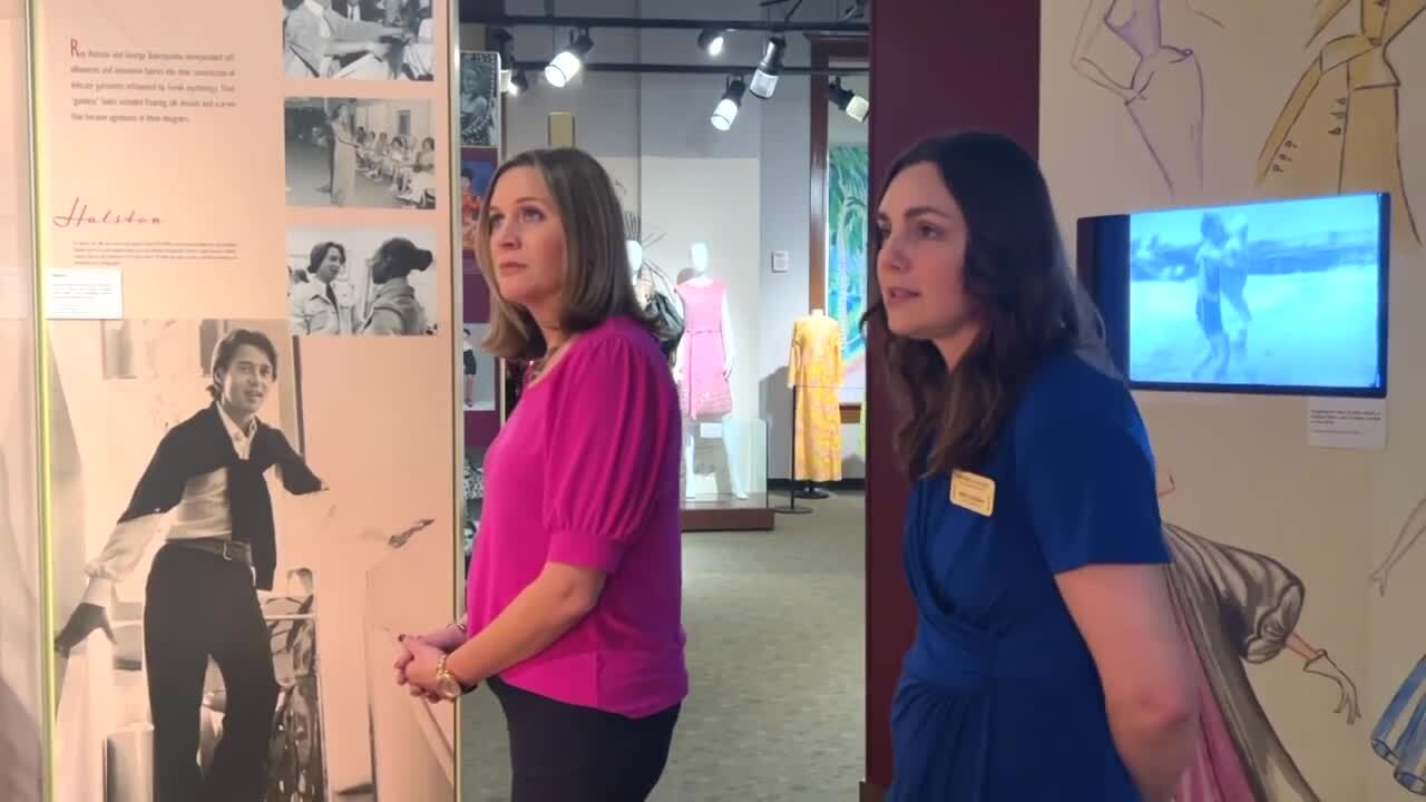 Rose Guerrero, the director of research at the Historical Society of Palm Beach County, shows WPTV journalist Stephanie Susskind examples of iconic Palm Beach resort wear.jpg
