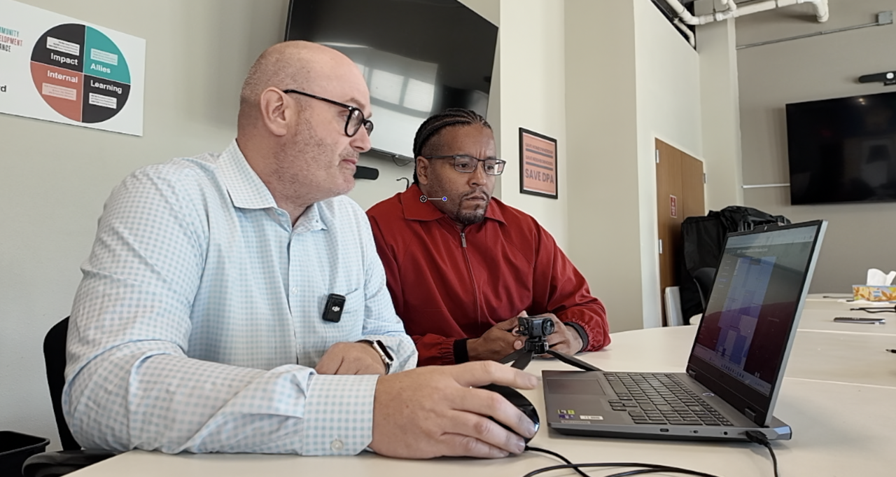 Gideon gets a demo of the displacement dashboard