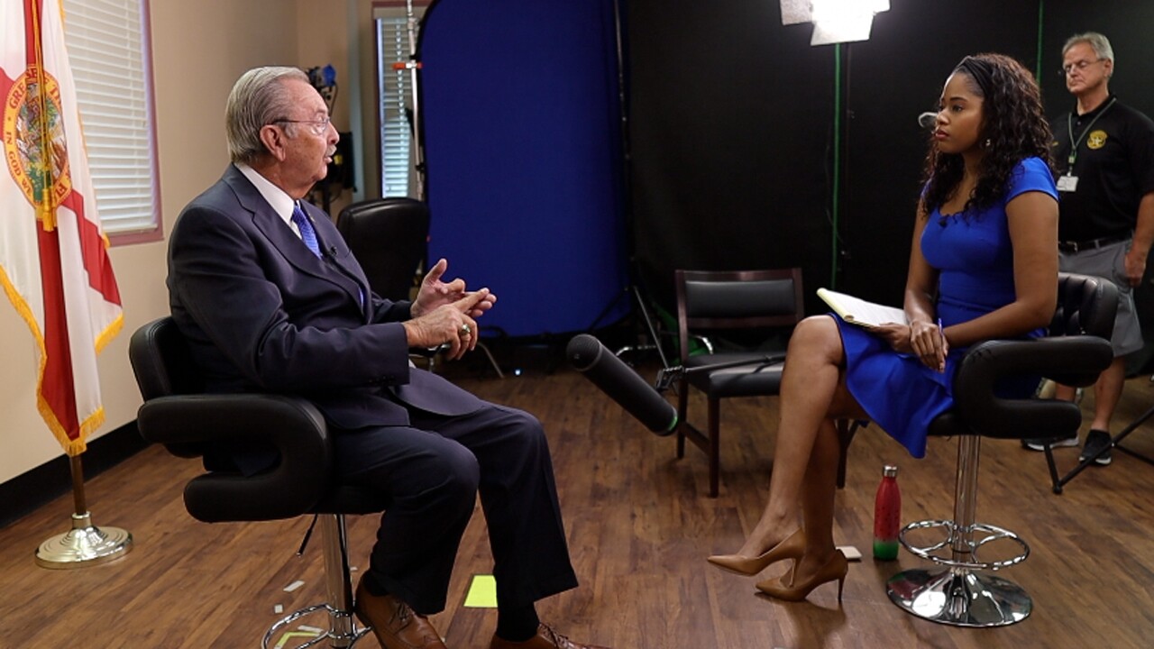 Palm Beach County Sheriff Ric Bradshaw and WPTV reporter Sabirah Rayford