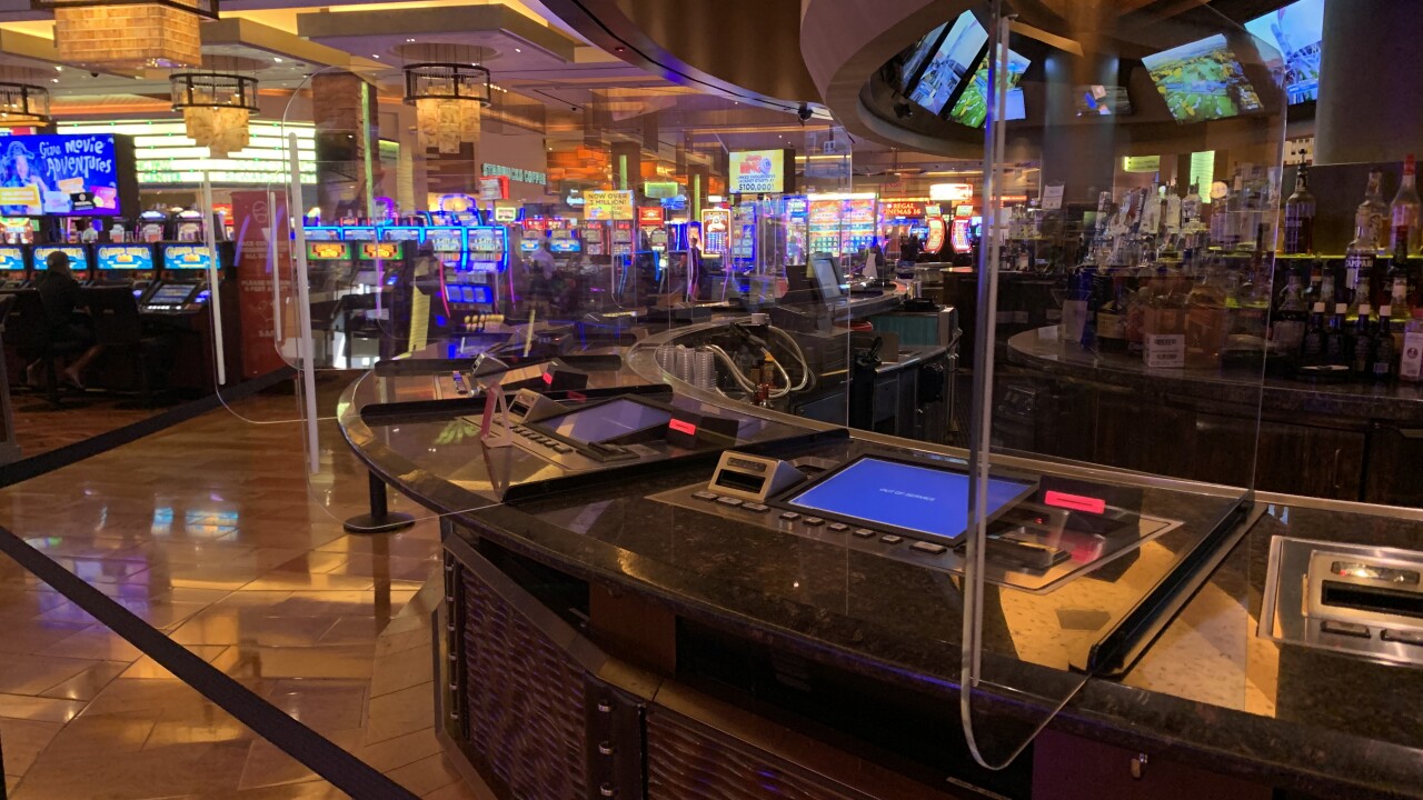 These are plastic dividers located at bar tops with gaming machines as seen in Sept. 2020