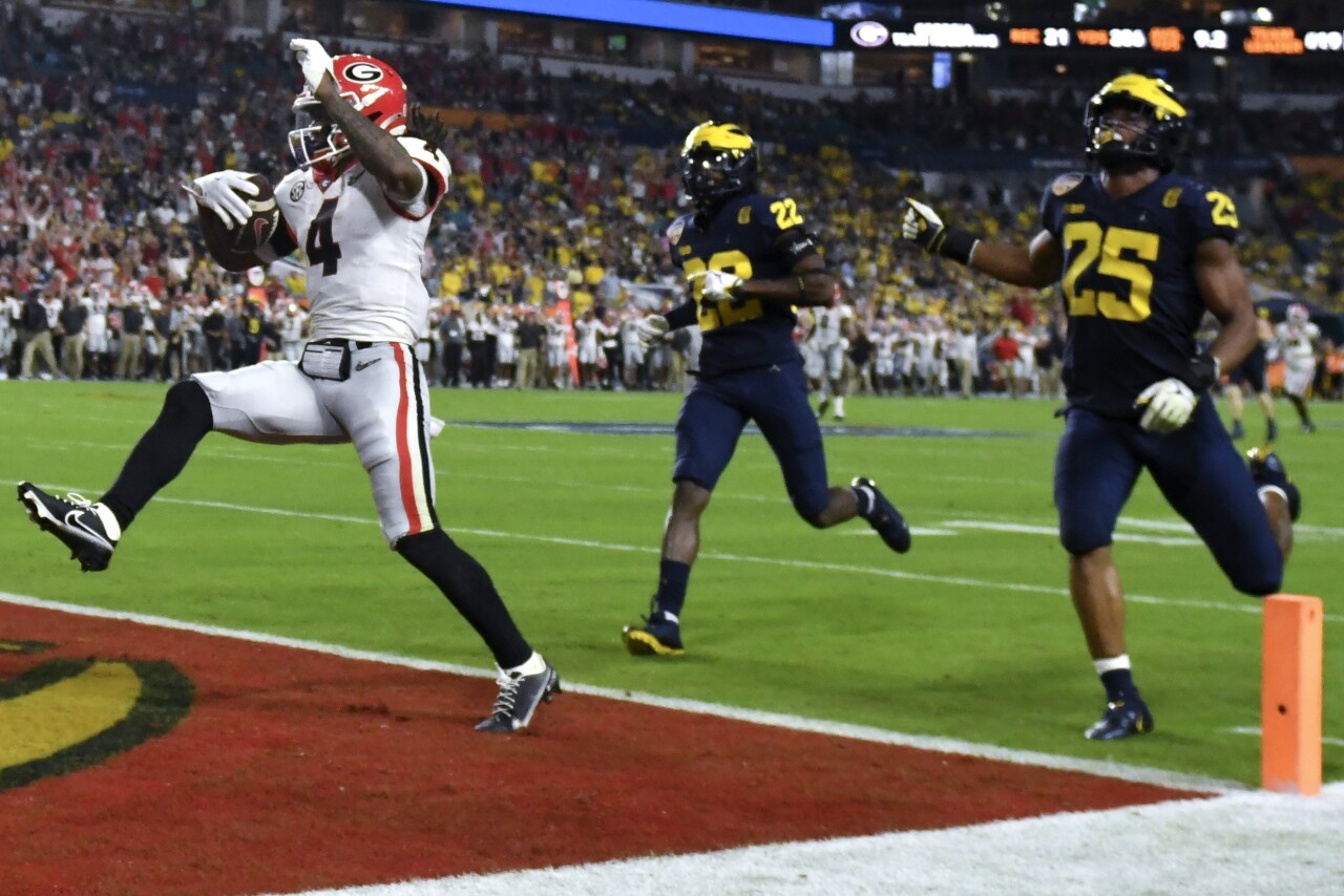 Georgia Bulldogs running back James Cook celebrates after scoring TD vs. Michigan Wolverines in College Football Playoff semifinal at Orange Bowl