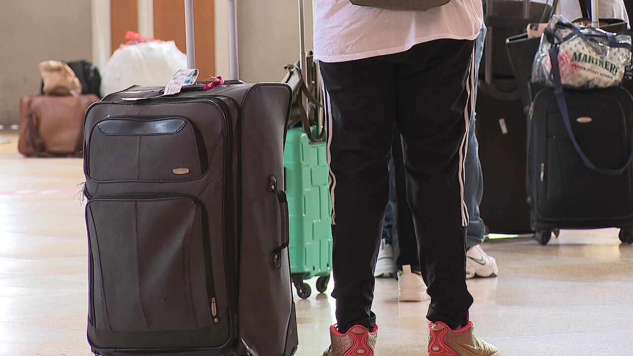 A passenger waits to board a bus at the Greyhound station in Downtown Cleveland.
