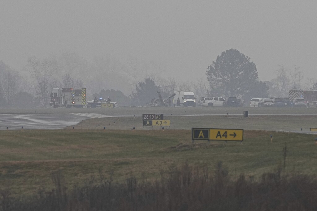 First responders tend to the scene of a reported plane crash at a regional airport in Statesville, N.C.