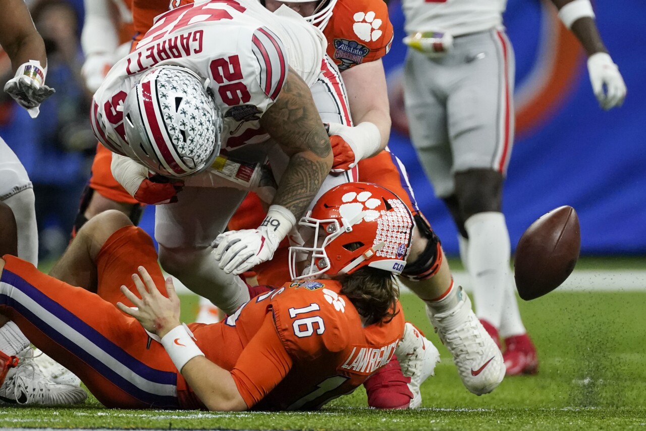 Ohio State Buckeyes defensive tackle Haskell Garrett forces Clemson Tigers QB Trevor Lawrence fumble in College Football Playoff at Sugar Bowl