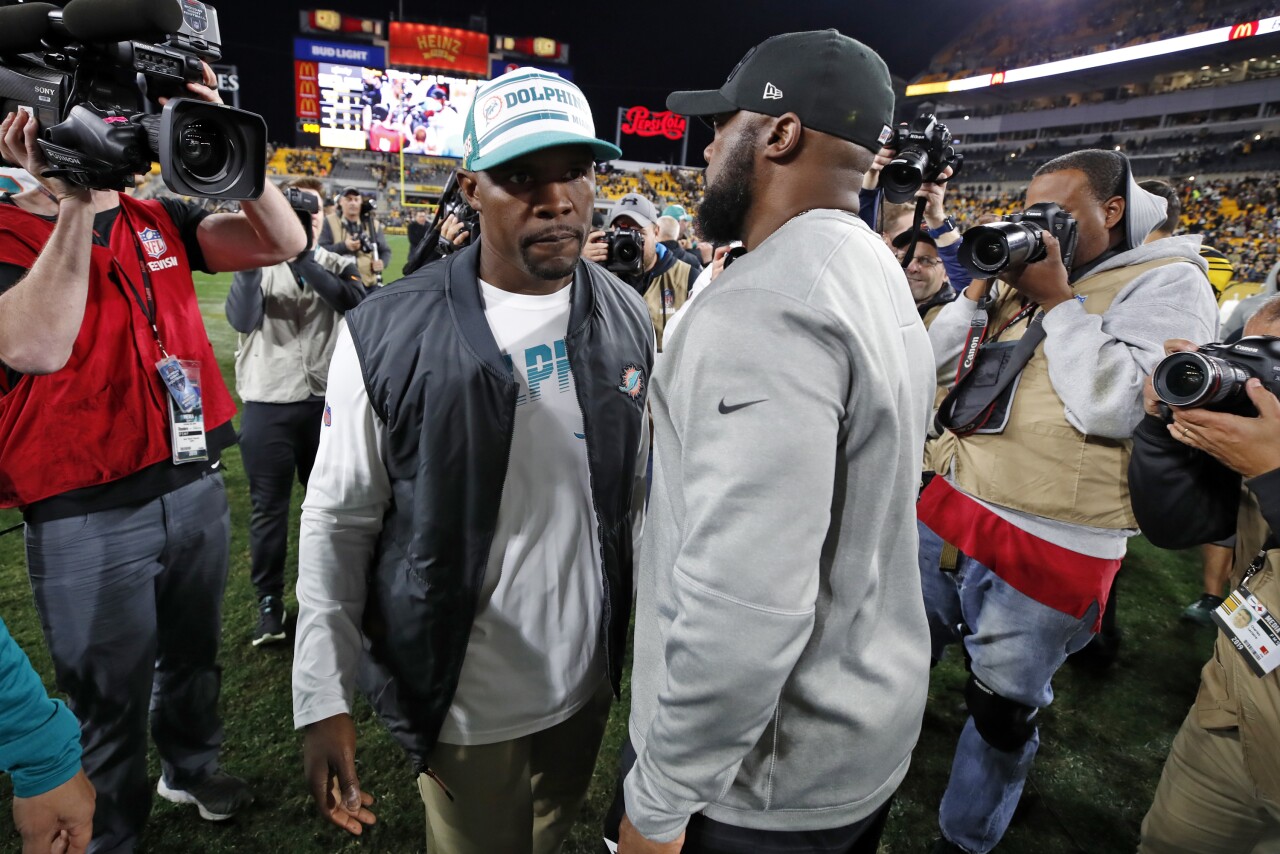 Miami Dolphins head coach Brian Flores and Pittsburgh Steelers head coach Mike Tomlin meet at mid-field in 2019