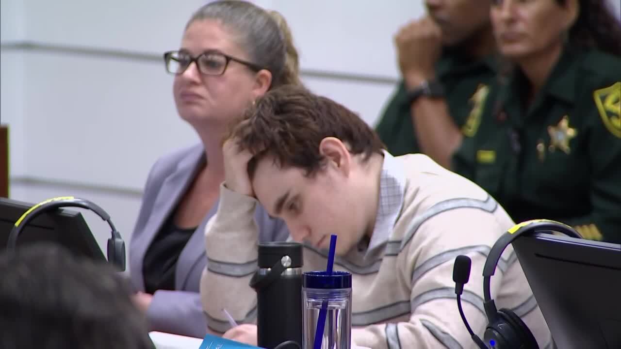 Nikolas Cruz looks down as prosecutor Mike Satz reads names of victims during closing arguments in penalty phase of his murder trial, Oct. 11, 2022