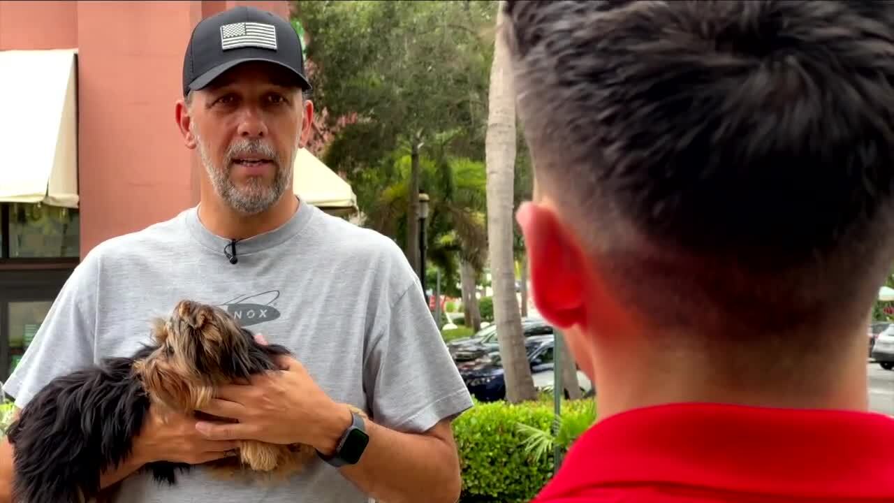 Gustavo Carvalho with service dog Minucho speaks to WPTV's Joel Lopez outside Publix, Aug. 18, 2023