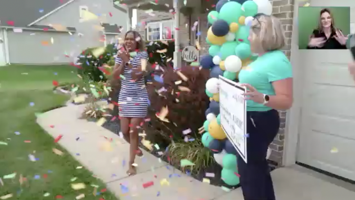 LaTonda receiving her check