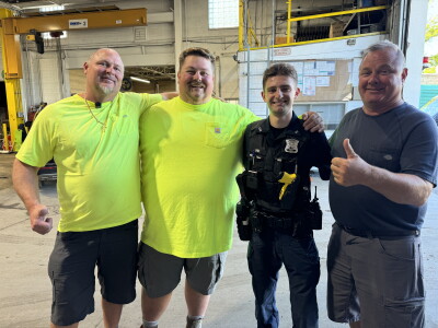 A sanitation worker's life was saved by co-workers and a police officer after a broken glass causes severe injury