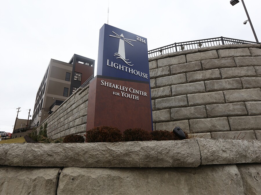 The Lighthouse Sheakley Center for Youth sits atop a hill in Mount Auburn. This photo shows the sign leading up to the building.