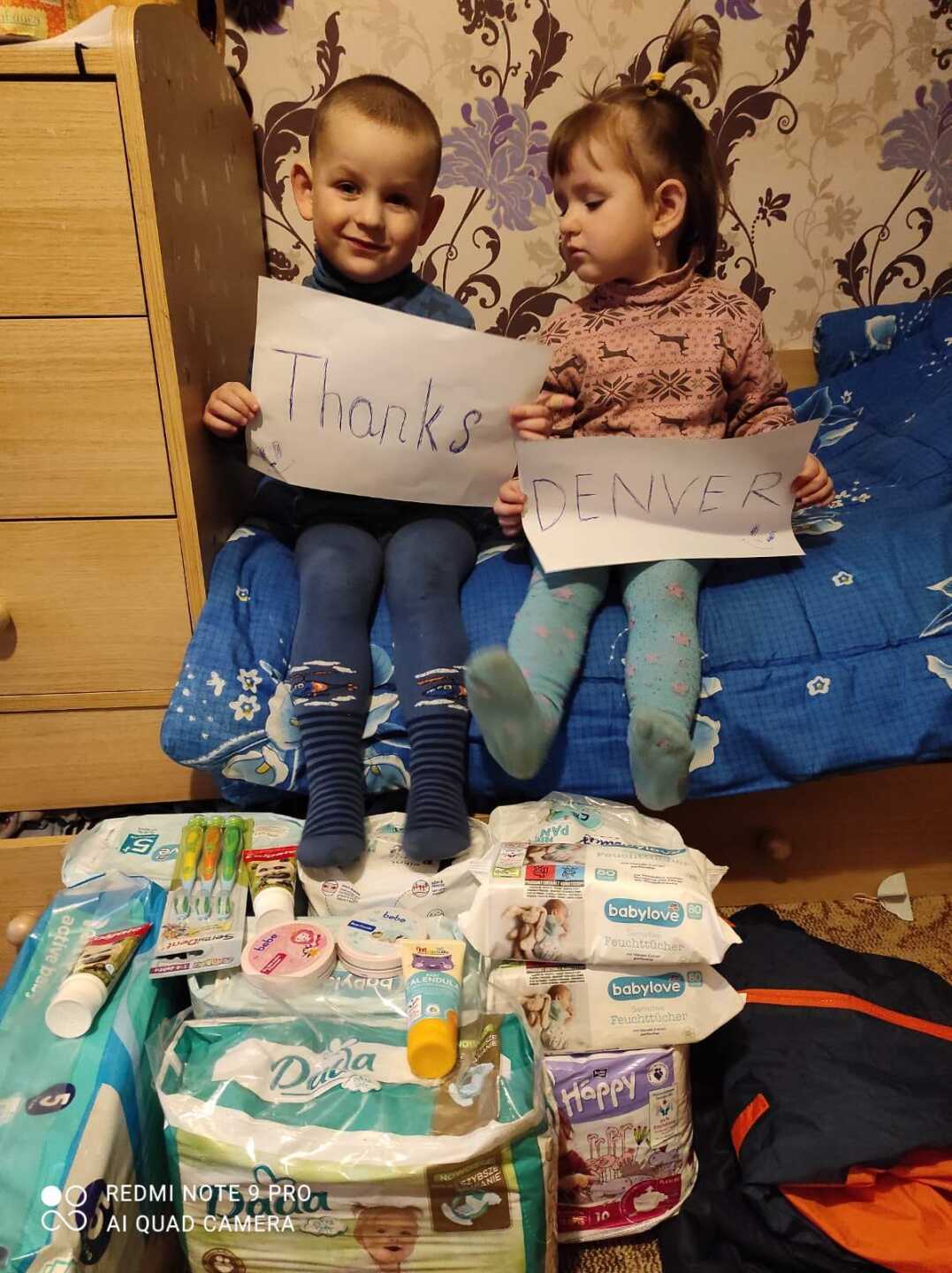 Two small Ukrainian children thanking Denver